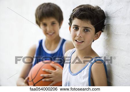 Stock Photograph - Young basketball players, portrait. Fotosearch