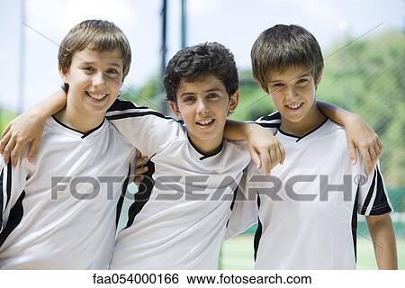 Young friends with arms around each other's shoulders, portrait View Large Photo Image Stock Photograph - Young friends with arms around each other's shoulders, portrait. Fotosearch