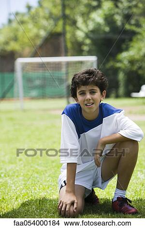Picture - Young soccer player, portrait. Fotosearch