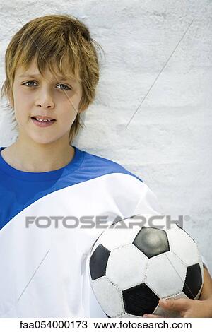 Stock Image - Young soccer player, portrait. Fotosearch