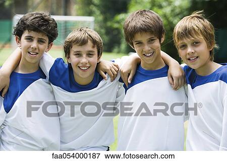 Stock Photo - Young soccer teammates, portrait. Fotosearch