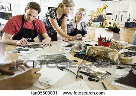 Art teacher assisting students with charcoal drawings View Large Photo Image Stock Image - Art teacher assisting students with charcoal drawings. Fotosearch