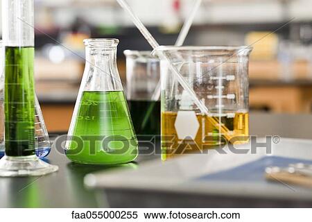 Beakers filled with chemicals View Large Photo Image Stock Photography - Beakers filled with chemicals. Fotosearch