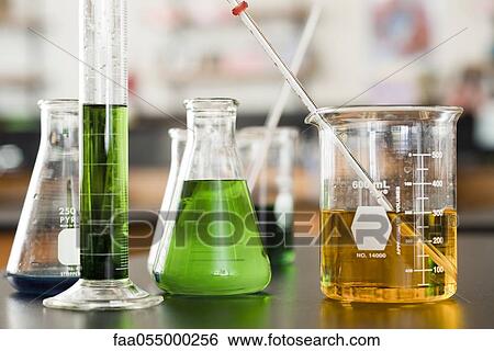 Stock Photograph - Chemicals in beakers. Fotosearch