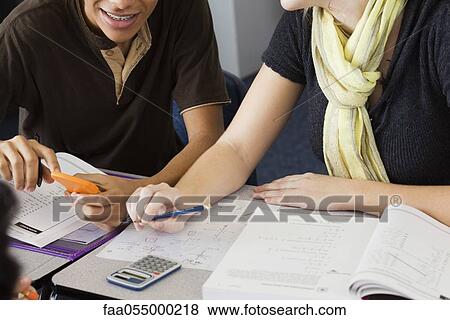 Stock Photo - Classmates studying mathematics together. Fotosearch