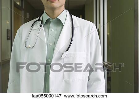 Stock Photo - Doctor with stethoscope around neck. Fotosearch