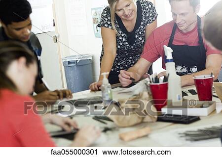 Stock Image - Drawing with charcoal in art class. Fotosearch