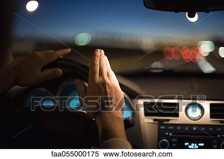 Driver drumming hands on steering wheel View Large Photo Image Stock Photography - Driver drumming hands on steering wheel. Fotosearch