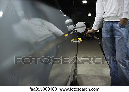 Driver refueling car View Large Photo Image Stock Image - Driver refueling car. Fotosearch