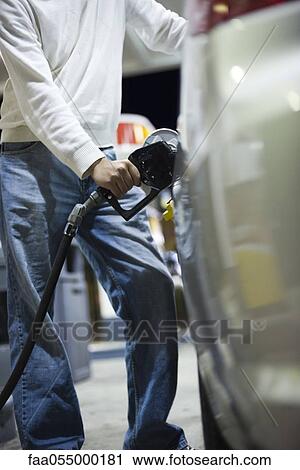 Driver refueling car View Large Photo Image Stock Image - Driver refueling car. Fotosearch