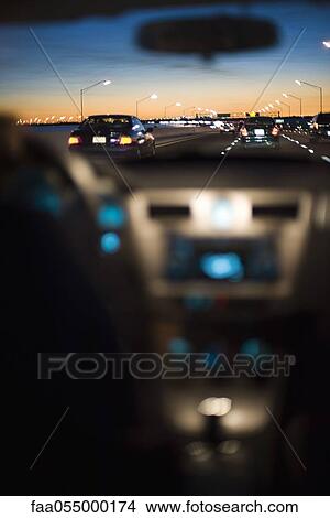Picture - Driving at sunset. Fotosearch