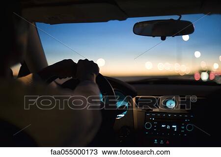 Stock Image - Driving at twilight. Fotosearch