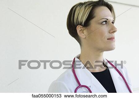 Female doctor contemplatively looking away, portrait View Large Photo Image Stock Image - Female doctor contemplatively looking away, portrait. Fotosearch
