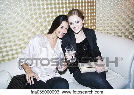 Friends enjoying night out together at night club, portrait View Large Photo Image Stock Image - Friends enjoying night out together at night club, portrait. Fotosearch