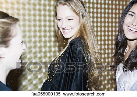 Friends having fun together at night club View Large Photo Image Stock Photography - Friends having fun together at night club. Fotosearch