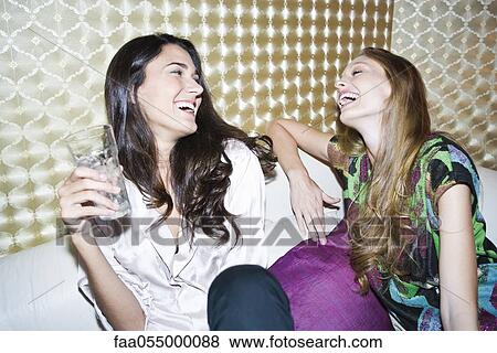 Friends laughing together View Large Photo Image Stock Photo - Friends laughing together. Fotosearch