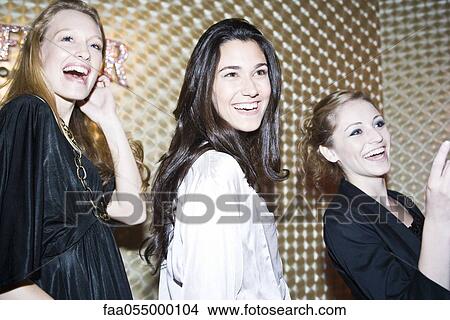Friends out together at night club View Large Photo Image Picture - Friends out together at night club. Fotosearch