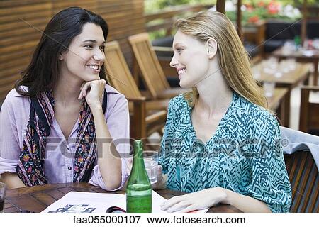 Stock Photo - Friends together at cafe. Fotosearch