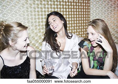 Friends together at nightclub View Large Photo Image Stock Image - Friends together at nightclub. Fotosearch