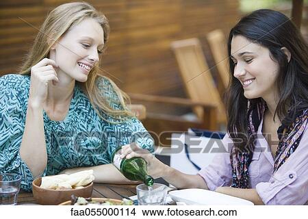 Picture - Friends together at restaurant. Fotosearch