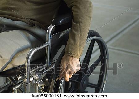 Handicapped person in wheelchair View Large Photo Image Stock Image - Handicapped person in wheelchair. Fotosearch