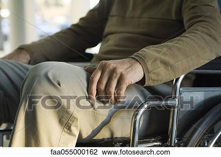 Handicapped person in wheelchair View Large Photo Image Stock Image - Handicapped person in wheelchair. Fotosearch