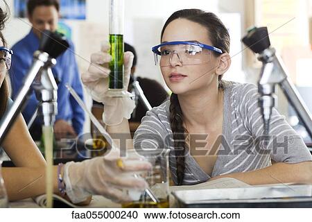 High school student conducting experiment in science class View Large Photo Image Stock Image - High school student conducting experiment in science class. Fotosearch
