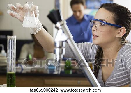 High school student conducting experiment in chemistry class View Large Photo Image Stock Image - High school student conducting experiment in chemistry class. Fotosearch
