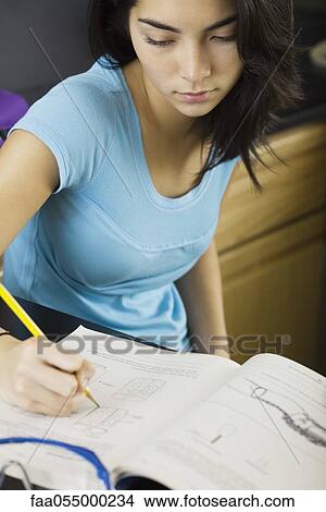High school student doing classwork View Large Photo Image Picture - High school student doing classwork. Fotosearch