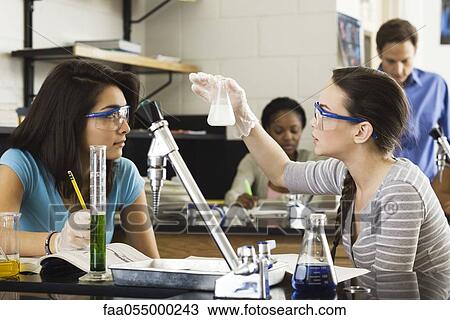 High school students conducting experiment in chemistry class View Large Photo Image Stock Image - High school students conducting experiment in chemistry class. Fotosearch