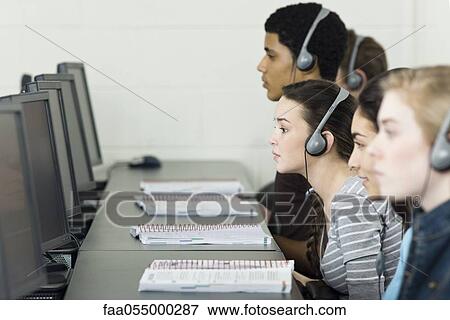 Stock Photo - High school students learning in computer lab. Fotosearch