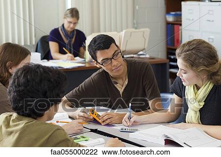 Stock Image - High school students studying math together. Fotosearch