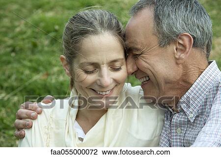 Mature couple embracing, eyes closed View Large Photo Image Stock Image - Mature couple embracing, eyes closed. Fotosearch