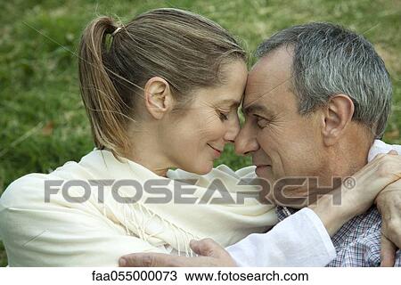 Mature couple embracing, nuzzling View Large Photo Image Stock Image - Mature couple embracing, nuzzling. Fotosearch
