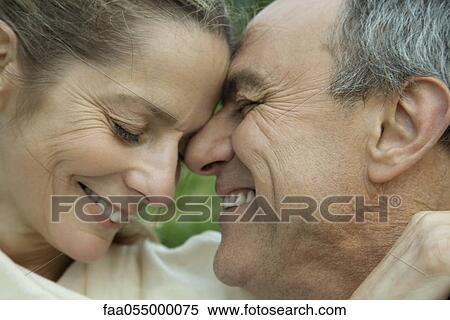Mature couple embracing, nuzzling View Large Photo Image Stock Photography - Mature couple embracing, nuzzling. Fotosearch