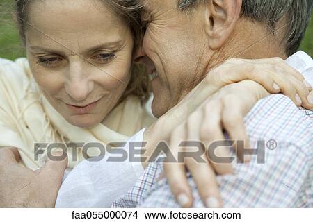 Mature couple embracing View Large Photo Image Picture - Mature couple embracing. Fotosearch