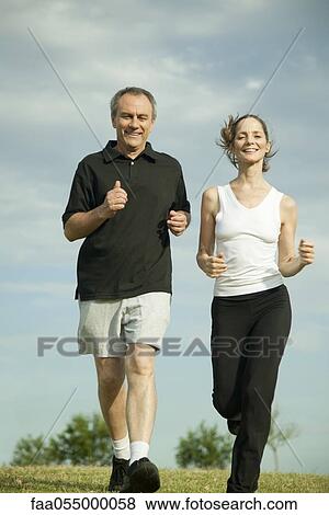 Mature couple jogging together View Large Photo Image Stock Photo - Mature couple jogging together. Fotosearch
