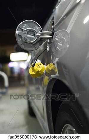 Stock Photo - Open gas tank on car. Fotosearch