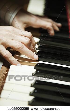 Playing piano, close-up View Large Photo Image Stock Photograph - Playing piano, close-up. Fotosearch