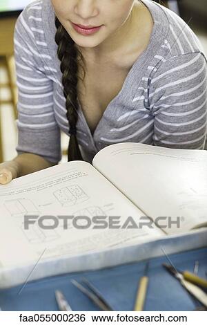 Student studying textbook View Large Photo Image Stock Photograph - Student studying textbook. Fotosearch