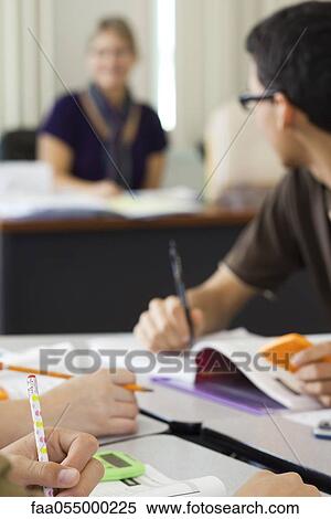 Stock Photography - Students completing assignment in math class. Fotosearch