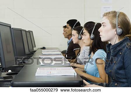 Stock Photo - Students learning in computer lab. Fotosearch