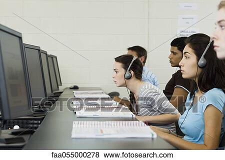 Students studying in computer lab, one leaning forward to see screen View Large Photo Image Stock Photo - Students studying in computer lab, one leaning forward to see screen. Fotosearch