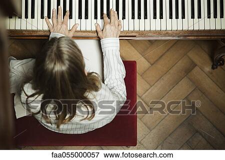 Woman playing piano View Large Photo Image Stock Photo - Woman playing piano. Fotosearch