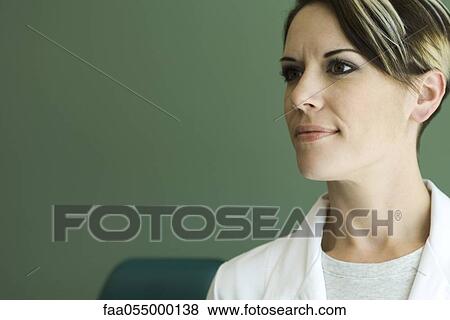 Young woman contemplatively looking away, portrait View Large Photo Image Stock Photo - Young woman contemplatively looking away, portrait. Fotosearch