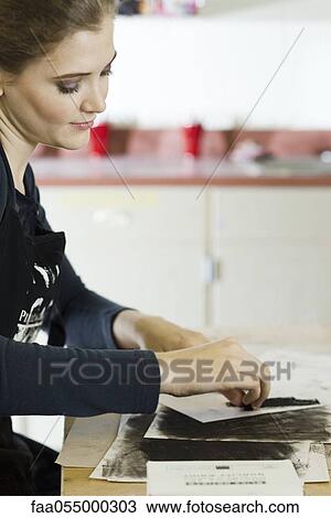 Young woman drawing with charcoal View Large Photo Image Stock Image - Young woman drawing with charcoal. Fotosearch
