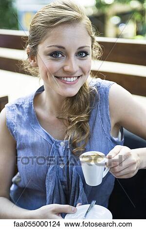 Young woman drinking espresso, portrait View Large Photo Image Picture - Young woman drinking espresso, portrait. Fotosearch
