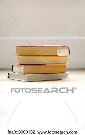 Books stacked on floor View Large Photo Image Stock Image - Books stacked on floor. Fotosearch
