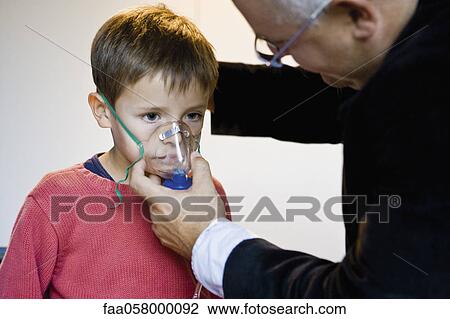 Boy receiving oxygen treatment View Large Photo Image Stock Image - Boy receiving oxygen treatment. Fotosearch
