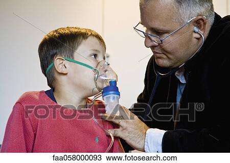Boy receiving oxygen treatment View Large Photo Image Stock Image - Boy receiving oxygen treatment. Fotosearch
